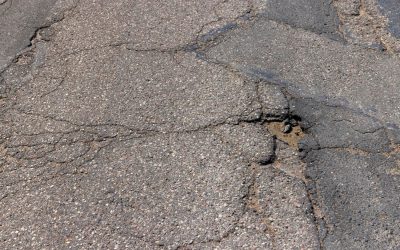 Common Asphalt Problems (Cracks, Potholes, Drainage) — And Why Timely Repairs Save You Money